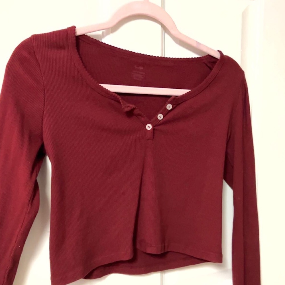 Brandy Melville long sleeve. Red ribbed texture w/ details on seems and buttons